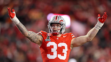 Dec 21, 2024; Columbus, Ohio, USA;  Ohio State Buckeyes defensive end Jack Sawyer (33) gets the crowd going during the second quarter against the Tennessee Volunteers at Ohio Stadium. Mandatory Credit: Joseph Maiorana-Imagn Images