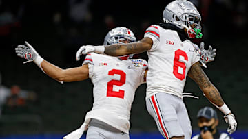 Ohio State Buckeyes wide receiver Jameson Williams (6) celebrates his touchdown with wide receiver Chris Olave (2) against Clemson Tigers in the fourth quarter during the College Football Playoff semifinal at the Allstate Sugar Bowl in the Mercedes-Benz Superdome in New Orleans on Friday, Jan. 1, 2021.

College Football Playoff Ohio State Faces Clemson In Sugar Bowl