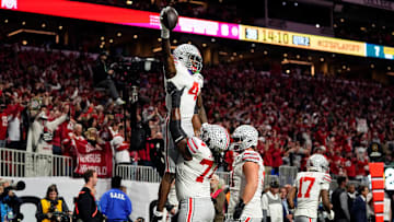 Ohio State Buckeyes wide receiver Jeremiah Smith (4) celebrates with offensive lineman Donovan Jackson (74) after a touchdown catch against Notre Dame Fighting Irish in the first quarter during the College Football Playoff National Championship at Mercedes-Benz Stadium in Atlanta on January 20, 2025.