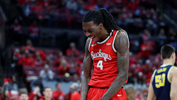 Feb 16, 2025; Columbus, Ohio, USA;  Ohio State Buckeyes forward Aaron Bradshaw (4) reacts to fhis dunk during the second half against the Michigan Wolverines at Value City Arena. Mandatory Credit: Joseph Maiorana-Imagn Images