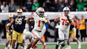 Ohio State Buckeyes running back Quinshon Judkins (1) gets away from the Notre Dame Fighting Irish defense for a long run in the third quarter during the College Football Playoff championship at Mercedes-Benz Stadium in Atlanta on January 20, 2025.