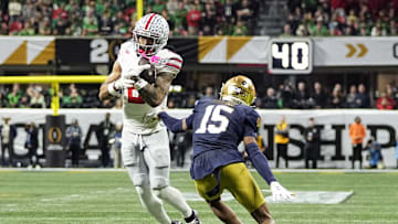 Ohio State Buckeyes wide receiver Emeka Egbuka (2) makes a catch against Notre Dame Fighting Irish cornerback Leonard Moore (15) in the third quarter during the College Football Playoff championship at Mercedes-Benz Stadium in Atlanta on January 20, 2025.