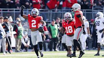 Nov 1, 2025; Columbus, Ohio, USA; Ohio State Buckeyes defensive back Caleb Downs (2) celebrates his interception during the fourth quarter against the Penn State Nittany Lions at Ohio Stadium. Mandatory Credit: Joseph Maiorana-Imagn Images