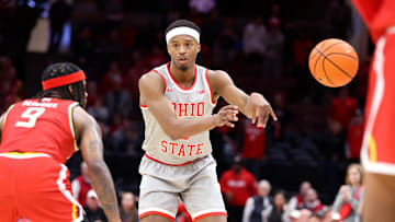 Feb 6, 2025; Columbus, Ohio, USA;  Ohio State Buckeyes guard Micah Parrish (8) passes against Maryland Terrapins guard Selton Miguel (9) during the second half at Value City Arena. Mandatory Credit: Joseph Maiorana-Imagn Images