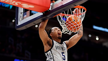 Feb 19, 2025; Washington, District of Columbia, USA; Georgetown Hoyas guard Micah Peavy (5) dunks during the first half against the Providence Friars at Capital One Arena. Mandatory Credit: Daniel Kucin Jr.-Imagn Images