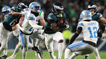 Nov 16, 2025; Philadelphia, Pennsylvania, USA; Philadelphia Eagles running back Tank Bigsby (37) rushes the ball against Detroit Lions safety Thomas Harper (12)  during the first half at Lincoln Financial Field. Mandatory Credit: Bill Streicher-Imagn Images