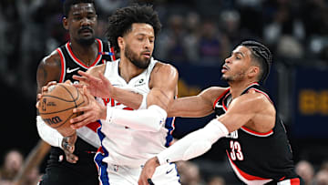 Jan 6, 2025; Detroit, Michigan, USA; Portland Trail Blazers forward Toumani Camara (33) tries to knock the ball away from Detroit Pistons guard Cade Cunningham (2) in the second quarter at Little Caesars Arena. Mandatory Credit: Lon Horwedel-Imagn Images