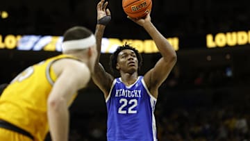 Mar 8, 2025; Columbia, Missouri, USA; Kentucky Wildcats center Amari Williams (22) shoots a free-throw in the second half against the Missouri Tigers at Mizzou Arena. Mandatory Credit: Gary Rohman-Imagn Images