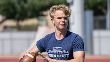 Higley High School quarterback Luke Haugo practices during spring training on campus in Gilbert on May 4, 2023.