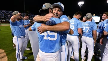 Jun 8, 2024; Chapel Hill, NC, USA; North Carolina Tar Heels pitcher Dalton Pence (49) head coach Scott Forbes (21) hug after winning the DI Baseball Super Regional over the West Virginia Mountaineers at Boshamer Stadium. Mandatory Credit: Jeffrey Camarati-USA TODAY Sports
