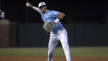 Jun 8, 2024; Chapel Hill, NC, USA; North Carolina Tar Heels Gavin Gallaher (5) makes a throw to first base against the West Virginia Mountaineers in the fifth inning of the DI Baseball Super Regional at Boshamer Stadium. Mandatory Credit: Jeffrey Camarati-USA TODAY Sports

