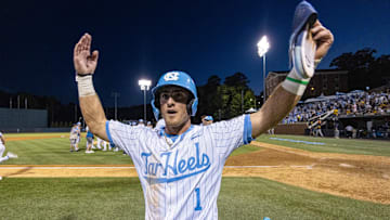 Jun 7, 2024; Chapel Hill, NC, USA; North Carolina Tar Heels Alex Madera (1) celebrates his team’s win over the West Virginia Mountaineers in the DI Baseball Super Regional at Boshamer Stadium.  Mandatory Credit: Jeffrey Camarati-Imagn Images

