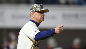 Ole Miss head coach Mike Bianco (5) makes a pitching change against Mississippi State at Swayze Field in Oxford, Miss., on Friday, Apr. 12, 2024.