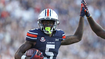 Sep 21, 2024; Auburn, Alabama, USA;  Auburn Tigers wide receiver KeAndre Lambert-Smith (5) celebrates his touchdown with a teammate during the fourth quarter against the Arkansas Razorbacks at Jordan-Hare Stadium. Mandatory Credit: John Reed-Imagn Images