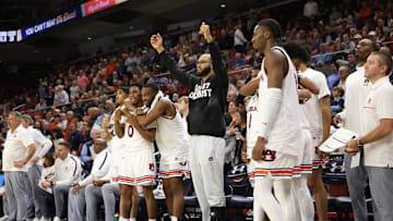 Jan 14, 2025; Auburn, Alabama, USA;  Auburn Tigers forward Johni Broome (in sweatshirt) celebrates with team mates towards the end of the game against the Mississippi State Bulldogs at Neville Arena.  Broome injured his ankle in the game against South Carolina and is still in a boot. Mandatory Credit: John Reed-Imagn Images