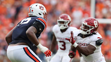 Sep 28, 2024; Auburn, Alabama, USA;  Oklahoma Sooners defensive lineman R Mason Thomas (32) moves in to block Auburn Tigers offensive lineman Izavion Miller (72) during the third quarter at Jordan-Hare Stadium. Mandatory Credit: John Reed-Imagn Images