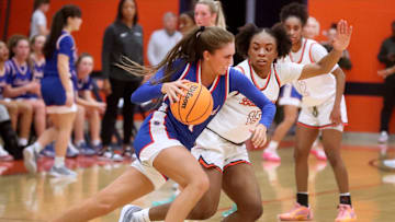 Cleveland's guard Lauren Hurst (11) tires to move the ball towards the basket as Blackman's forward Tishana Moore (15) guards her during the Girls Class 4A sectional basketball game at Blackman, on Saturday, March 2, 2024.