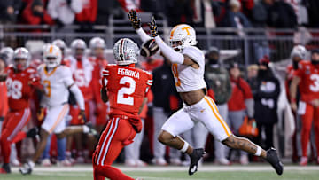 Dec 21, 2024; Columbus, Ohio, USA;  Ohio State Buckeyes wide receiver Emeka Egbuka (2) catches a long pass as Tennessee Volunteers defensive back Jakobe Thomas (9) defends during the first quarter at Ohio Stadium. Mandatory Credit: Joseph Maiorana-Imagn Images