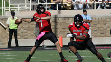 Oct 13, 2012; Lubbock, TX, USA; Texas Tech Red Raiders quarterback Seth Doege (7) prepares to pass against the West Virginia Mountaineers in the second half at Jones AT&T Stadium. Mandatory Credit: Michael C. Johnson-Imagn Images