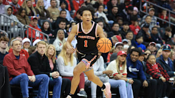 Dec 21, 2024; Newark, New Jersey, USA; St. John's basketball transfer target Xaivian Lee (1) dribbles the ball against the Rutgers Scarlet Knights during the second half at Prudential Center. Mandatory Credit: Tom Horak-Imagn Images