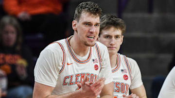 Clemson sophomore center Viktor Lakhin (0) claps from the bench with Clemson forward Asa Thomas (5) during the first half at Littlejohn Coliseum in Clemson, S.C Saturday, January 11, 2025.