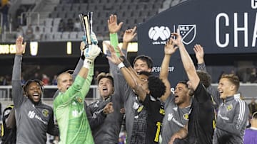 Sep 29, 2021; Columbus, OH, USA; Columbus Crew goalkeeper Evan Bush (24) holds the trophy surrounded by teammates after defeating Cruz Azul to win  the 2021 Campeones Cup match at Lower.com Field Mandatory Credit: Greg Bartram-USA TODAY Sports