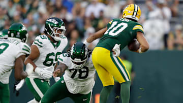 New York Jets defensive tackle Jay Tufele (78) sacks Green Bay Packers quarterback Jordan Love (10) during their football game Saturday, August 9, 2025, at Lambeau Field in Green Bay, Wisconsin.