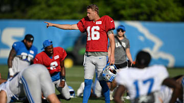 Jul 28, 2025; Allen Park, MI, USA;  Detroit Lions quarterback Jared Goff (16) gives directions to his teammates as they finish stretching during training camp at Meijer Performance Center. Mandatory Credit: Lon Horwedel-Imagn Images