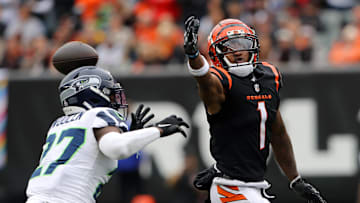Oct 15, 2023; Cincinnati, Ohio, USA;  Cincinnati Bengals wide receiver Ja'Marr Chase (1) loses the ball as Seattle Seahawks cornerback Riq Woolen (27) defends on the play during the second quarter at Paycor Stadium. Mandatory Credit: Joseph Maiorana-Imagn Images