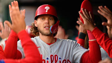 Mar 27, 2025; Washington, District of Columbia, USA; Philadelphia Phillies third baseman Alec Bohm celebrates after scoring a run during the 10th inning at Nationals Park.