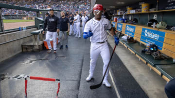  Detroit Tigers second baseman Andy Ibanez (77) celebrates in the dugout after hitting a home run.