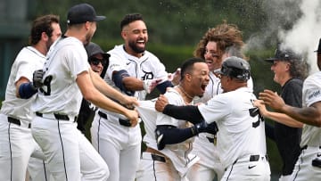 Jul 14, 2024; Detroit, Michigan, USA;  Detroit Tigers right fielder Wenceel Pérez (46) celebrates with teammates after his bunt scored the game-winning run against the Los Angeles Dodgers in the ninth inning at Comerica Park. Mandatory Credit: Lon Horwedel-USA TODAY Sports