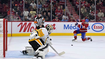 Sep 22, 2025; Montreal, Quebec, CAN;Pittsburgh Penguins goalie Sergei Murashov (1) stops Montreal Canadiens forward Ivan Demidov (93) during the overtime period at the Bell Centre. Mandatory Credit: Eric Bolte-Imagn Images