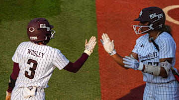 Texas A&M infielder Koko Wooley (3) high fives outfielder Jazmine Hill (77) after a score during the game three NCAA Super Regional against the Texas Longhorns at Red & Charline McCombs Field on Sunday, May 26, 2024 in Austin.