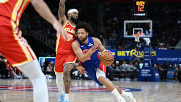 Dec 12, 2025; Detroit, Michigan, USA; Detroit Pistons guard Cade Cunningham (2) drives past Atlanta Hawks guard Nickeil Alexander-Walker (7) in the first quarter at Little Caesars Arena. Mandatory Credit: Lon Horwedel-Imagn Images