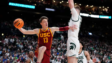 Mar 17, 2023; Columbus, Ohio, USA;  USC Trojans guard Drew Peterson (13) passes around Michigan State Spartans center Carson Cooper (15) during the first round of the NCAA men   s basketball tournament at Nationwide Arena. Mandatory Credit: Adam Cairns-The Columbus Dispatch

Basketball Ncaa Men S Basketball Tournament