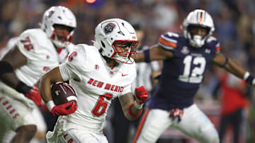 Sep 14, 2024; Auburn, Alabama, USA; New Mexico Lobos running back Eli Sanders (6) carries against the Auburn Tigers during the second quarter at Jordan-Hare Stadium. Mandatory Credit: John Reed-Imagn Images