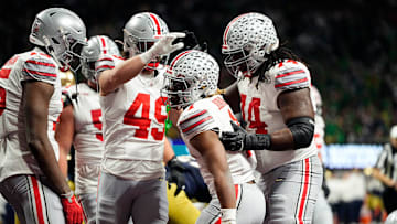 Ohio State Buckeyes running back Quinshon Judkins (1) scores a rushing touchdown against Notre Dame Fighting Irish in the third quarter during the College Football Playoff National Championship at Mercedes-Benz Stadium in Atlanta on January 20, 2025