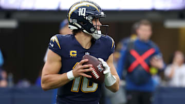 Nov 30, 2025; Inglewood, California, USA; Los Angeles Chargers quarterback Justin Herbert (10) drops back to pass against the Las Vegas Raiders during the first half at SoFi Stadium. Mandatory Credit: Kiyoshi Mio-Imagn Images