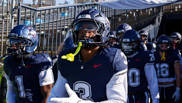 Nov 15, 2025; East Hartford, Connecticut, USA; The UConn Huskies head to the field for warm up before the start of the game against the Air Force Falcons at Pratt & Whitney Stadium at Rentschler Field. Mandatory Credit: David Butler II-Imagn Images