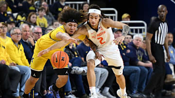 Mar 2, 2025; Ann Arbor, Michigan, USA; Michigan Wolverines guard Tre Donaldson (3) battles Illinois Fighting Illini guard Dra Gibbs-Lawhorn (2) for a loose ball in the first half at Crisler Center. Mandatory Credit: Lon Horwedel-Imagn Images
