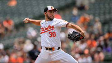 Jul 31, 2024; Baltimore, Maryland, USA; Baltimore Orioles pitcher Grayson Rodriguez (30) throws against the Toronto Blue Jays during the first inning at Oriole Park at Camden Yards.
