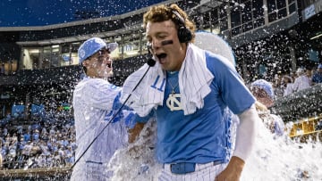 Jun 7, 2024; Chapel Hill, NC, USA; North Carolina Tar Heels Vance Honeycutt (7) is doused with water after his team defeated the West Virginia Mountaineers in the DI Baseball Super Regional at Boshamer Stadium.  Mandatory Credit: Jeffrey Camarati-USA TODAY Sports
