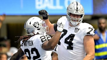 Sep 8, 2024; Inglewood, California, USA; Las Vegas Raiders running back Alexander Mattison (22) is congratulated by offensive tackle Kolton Miller (74) after scoring a touchdown in the first half against the Los Angeles Chargers at SoFi Stadium. Mandatory Credit: Jayne Kamin-Oncea-Imagn Images