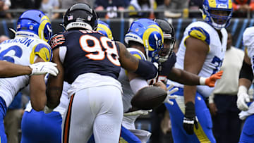 Sep 29, 2024; Chicago, Illinois, USA;  Los Angeles Rams quarterback Matthew Stafford (9) is sacked and fumbles the ball by Chicago Bears defensive end Montez Sweat (98) during the first half at Soldier Field. Mandatory Credit: Matt Marton-Imagn Images