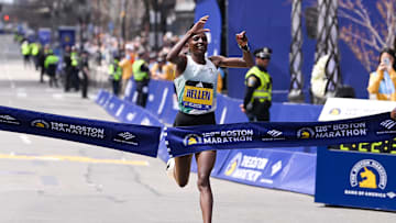 Hellen Obiri of Kenya crosses the finish line to win the women's division at the 2024 Boston Marathon.