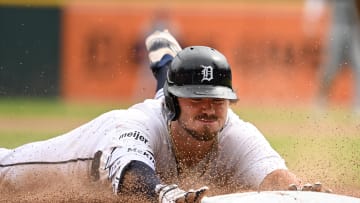 Jul 14, 2024; Detroit, Michigan, USA;  Detroit Tigers shortstop Zach McKinstry (39) slides safely into third base for a lead off triple against the Los Angeles Dodgers in the ninth inning at Comerica Park.