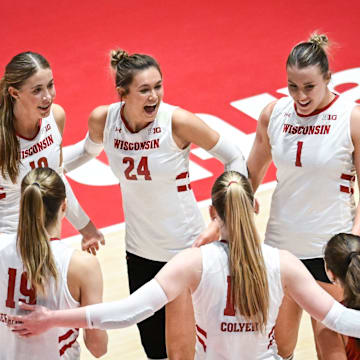 Wisconsin players Madison Quest (10), Charlie Fuerbringer (24), Ana Vajagic (1), Maile Chan (18), Mimi Colyer (15) and Tosia Serafinowska (19) celebrate match point against Marquette in a spring match Wednesday, April 16, 2025, at the UW Field House in Madison, Wisconsin.