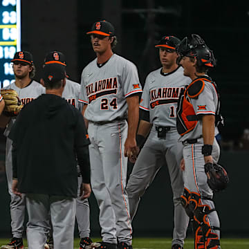 Oklahoma State head coach Josh Holliday approaches the mound to talk to pitcher Ryan Ure (24) during the game against the Texas Longhorns at UFCU Disch–Falk Field on Friday, May. 3, 2024 in Austin.