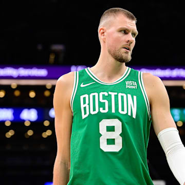 Dec 8, 2023; Boston, Massachusetts, USA;  Boston Celtics center Kristaps Porzingis (8) looks on during the first half against the New York Knicks at TD Garden. Mandatory Credit: Eric Canha-Imagn Images